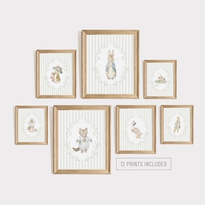 May include: A set of framed art prints with watercolour illustrations of storybook animals. Each print has a striped background and is framed in light wood. The prints include a rabbit, cat, and other characters.