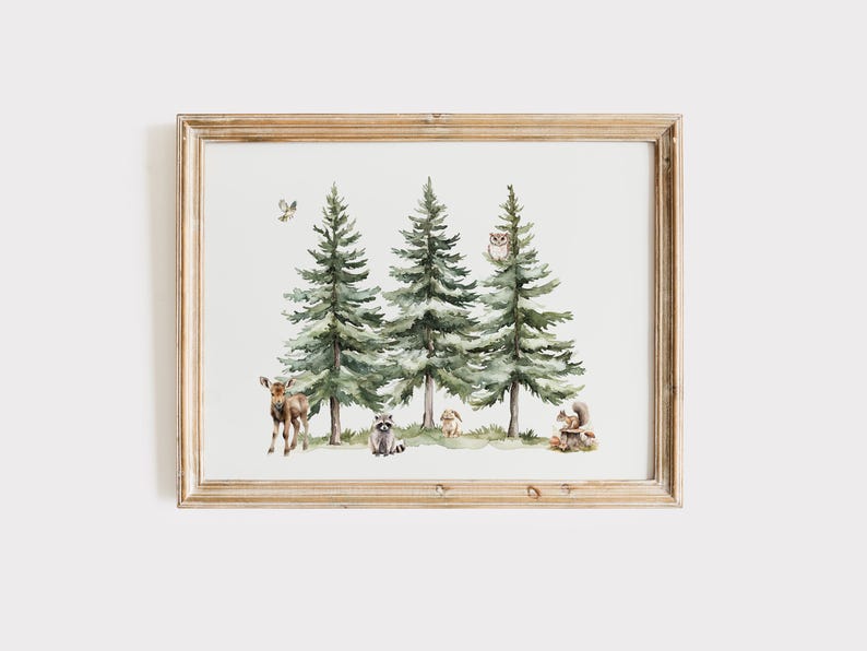 May include: Watercolor print of a forest scene with three tall green pine trees. A deer, raccoon, rabbit, and squirrel are among the trees. An owl sits in one of the trees, and a bird flies above. The artwork is in a light brown wooden frame.