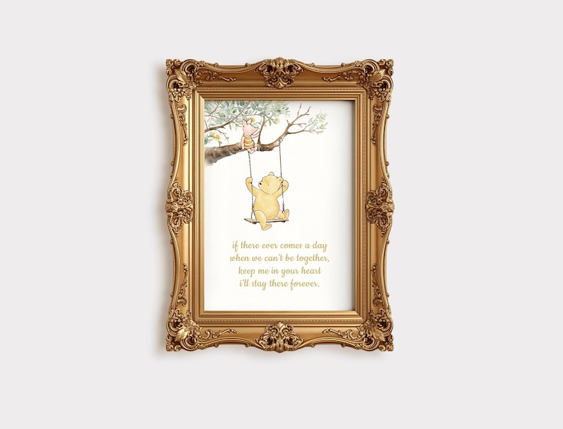 May include: A framed print featuring a watercolor illustration of Winnie the Pooh and Piglet on a swing. The gold frame surrounds the image and includes the quote: "If there ever comes a day when we can't be together, keep me in your heart I'll stay there forever."
