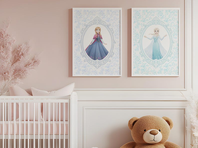 May include: Two framed prints featuring Disney princesses, Anna and Elsa, in ornate oval frames. The prints are set against a light blue floral patterned background. The room has a white crib, a brown teddy bear, and pink accents.