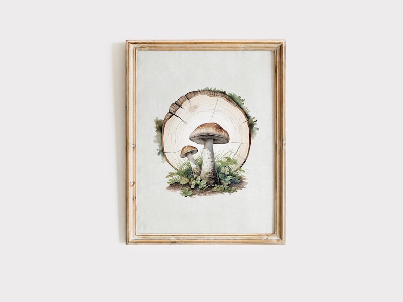 May include: Watercolor painting of two mushrooms with brown caps and white stems, growing in a bed of green moss and grass. The mushrooms are set against a backdrop of a tree trunk slice, all within a wooden frame.