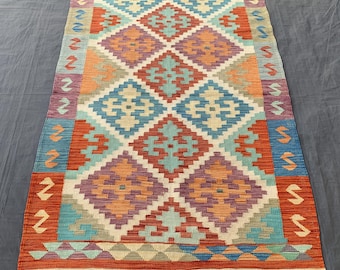 Vintage Turkish Kilim Rug: Handwoven Wool, Boho Decor (3.11x5.11 ft.)