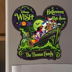 May include: A Mickey Mouse-shaped magnet featuring Disney Wish Halloween on the High Seas 2026 text. The design shows cartoon characters on a ship, a green potion bottle with a skull tag, and a banner at the bottom reading The Thomas Family.