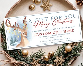 May include: A rectangular gift certificate template featuring a watercolor illustration of a deer with string lights on its antlers, blue pine trees, and the text A GIFT FOR YOU Merry Christmas, CUSTOM GIFT HERE, TO: Charlotte, FROM: Mom and Dad.