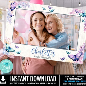 May include: A printable photo booth prop for a baby shower. The prop features a white wood background with a gray photo frame, purple and blue butterflies, and the text "Charlotte's Baby Shower".