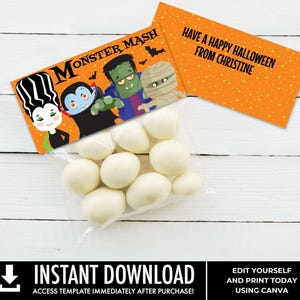 May include: A clear plastic bag filled with white round candies, topped with a rectangular orange card featuring cartoon monsters and the text MONSTER MASH, and a second orange card with the text HAVE A HAPPY HALLOWEEN FROM CHRISTINE.