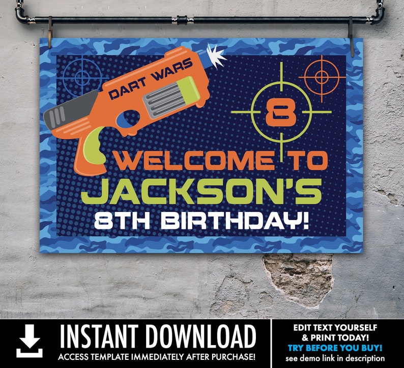 May include: A blue and green camouflage pattern birthday party sign with the text "Dart Wars" and "Welcome to Jackson's 8th Birthday!" The sign features a cartoon image of a toy gun with a target in the background.