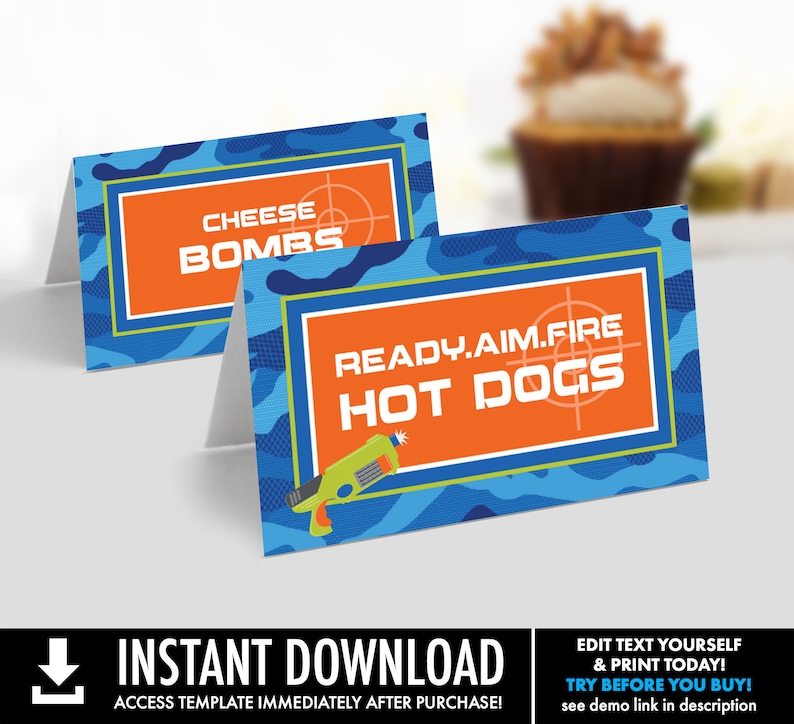 May include: Two printable food labels with a camouflage pattern in blue and green. The labels have orange borders and text that reads "Cheese Bombs" and "Ready. Aim. Fire Hot Dogs".
