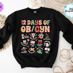 May include: Black sweatshirt with the text "12 Days of OB/GYN" in colorful letters. The design includes illustrations of medical items and phrases like "Irregular Periods," "Elevated BPS," and "Busy Clinic."