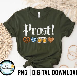 May include: An olive green t-shirt with the word "Prost!" in white, along with pretzel, heart, beer mug, and gingerbread heart graphics. The shirt also has the text "PNG | DIGITAL DOWNLOAD".