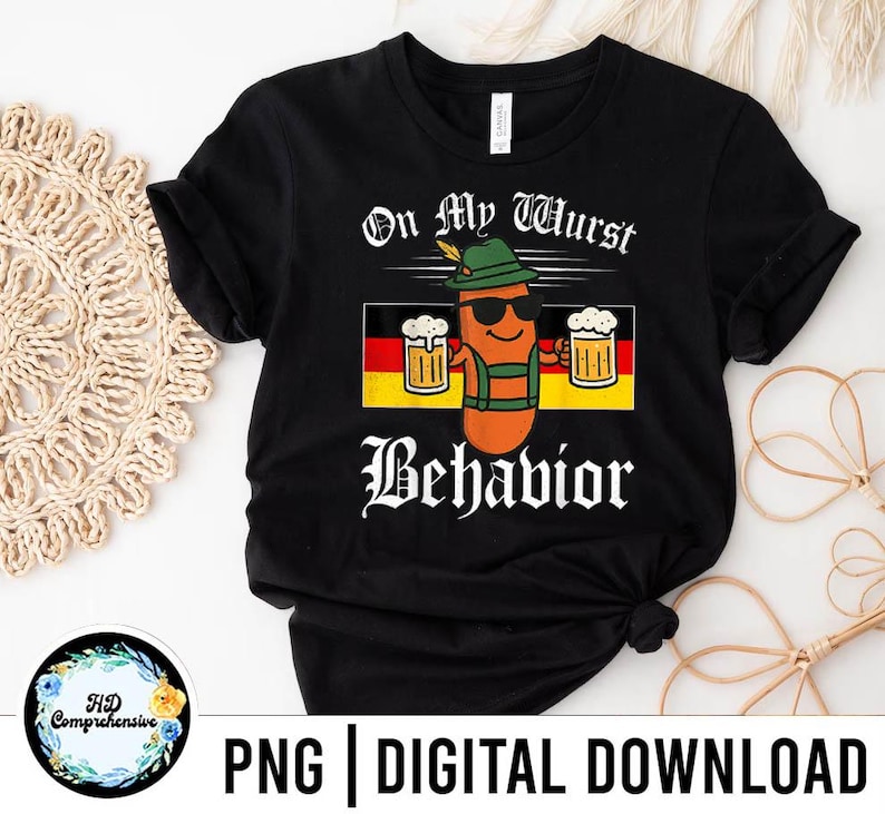 May include: Black t-shirt with the text "On My Wurst Behavior" and a cartoon sausage character wearing sunglasses, a hat, and lederhosen, holding two mugs of beer. The German flag is in the background.
