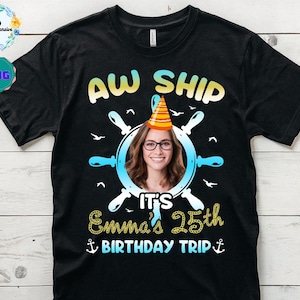 May include: Black t-shirt with a graphic design featuring a woman's face inside a ship's wheel, a party hat, and the words "AW SHIP". Below, it reads "It's Emma's 25th Birthday Trip" in gold lettering.