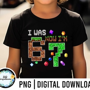 May include: Black t-shirt with the text "I WAS 6, NOW I'M 7" in pixelated font, with colorful gem graphics. The shirt is a digital download, perfect for a birthday celebration.