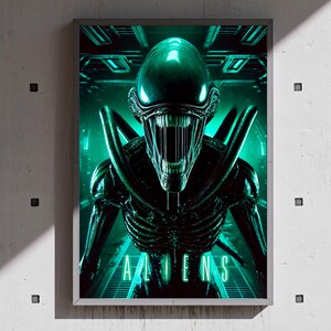 May include: A framed poster depicting an Alien creature in a sci-fi setting. The creature is dark green with a distinctive head and open mouth. The background is a teal-colored futuristic environment. The word "ALIENS" is displayed in teal.