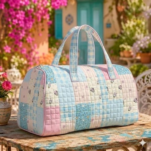 May include: A quilted duffel bag featuring a patchwork design in pastel blue, pink, and white. The fabric displays repeating patterns of Mickey Mouse silhouettes, stars, and gingham checks. It includes two top handles and a zipper closure.