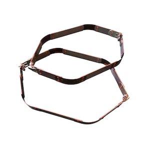 May include: A metal object with a rectangular shape, featuring a series of connected metal strips. The strips are held together with small rivets. The object appears to be made of a dark metal with a slightly aged appearance.