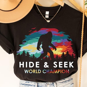 Bigfoot Hide & Seek Champion PNG - Retro Sunset Forest Sasquatch Sublimation Design for Camping, Hiking, and Outdoor Adventure