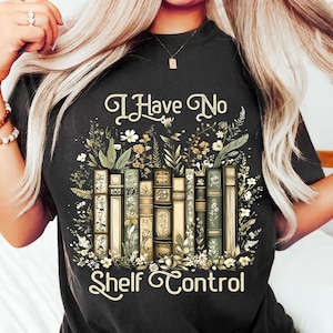 May include: A black t-shirt with a floral design and the text "I Have No Shelf Control".