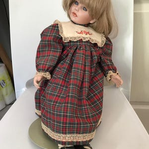 vintage porcelain doll in Plaid