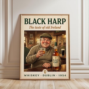 May include: A framed vintage advertisement for Black Harp Whiskey. The image shows a man in a pub holding a glass of whiskey, with a bottle of Black Harp Whiskey on the bar. Text includes "Black Harp", "The taste of old Ireland", "Whiskey, Dublin, 1954".