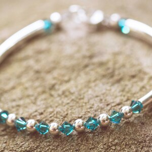 December Blue Zircon Swarovski Crystal Birth Month Sterling Silver Plated Bracelet on stone