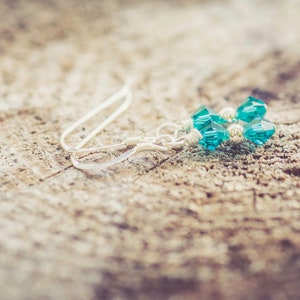 December Blue Zircon Swarovski Crystal Birth Month Sterling Silver Drop Earrings on wood background