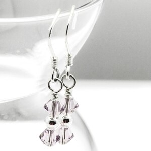 June Alexandrite Swarovski Crystal Birth Month Sterling Silver Drop Earrings hanging on vase