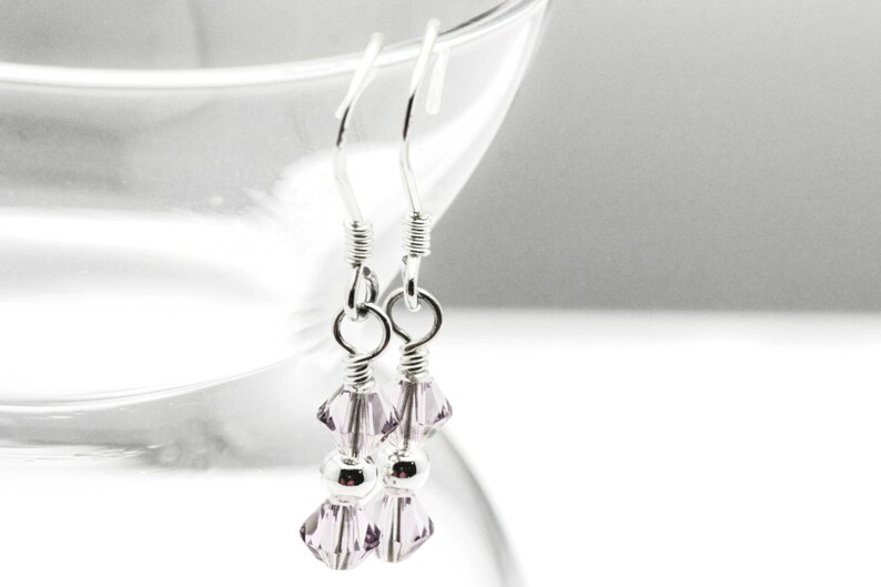 June Alexandrite Swarovski Crystal Birth Month Sterling Silver Drop Earrings hanging on vase