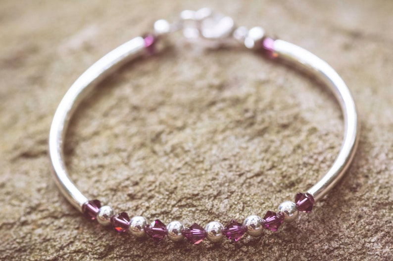 February Amethyst Swarovski Crystal Birth Month Sterling Silver Plated Bracelet on stone