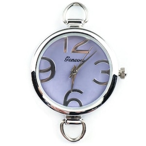 May include: A silver-toned wristwatch with a purple face and large, bold, black numbers. The watch face also has the word "Geneva" printed on it.