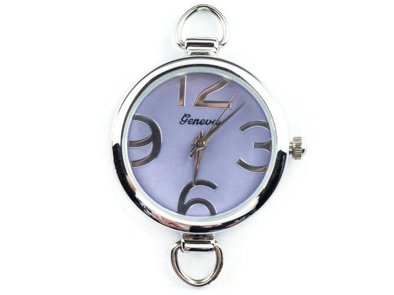 May include: A silver-toned wristwatch with a purple face and large, bold, black numbers. The watch face also has the word "Geneva" printed on it.