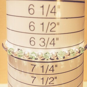 August Peridot Swarovski Crystal Birth Month Sterling Silver Plated Bracelet on bracelet measuring cone