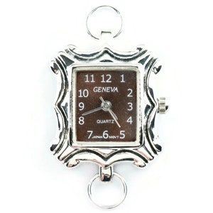 May include: A silver-toned watch with a square face and a brown dial. The watch face has black Roman numeral hour markers and the words "GENEVA" and "QUARTZ". The watch has a silver-toned metal band with a decorative design.