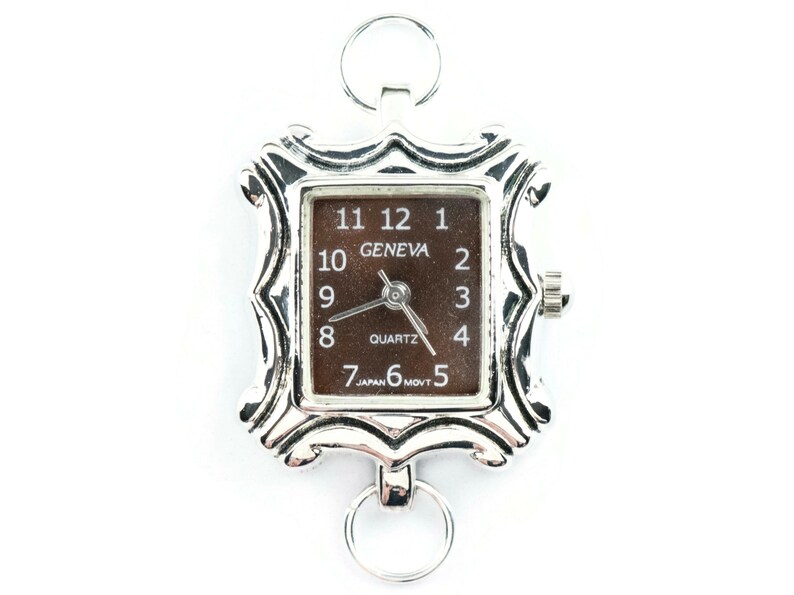 May include: A silver-toned watch with a square face and a brown dial. The watch face has black Roman numeral hour markers and the words "GENEVA" and "QUARTZ". The watch has a silver-toned metal band with a decorative design.