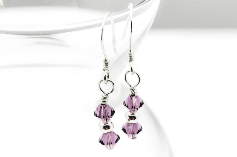 February Amethyst Swarovski Crystal Birth Month Sterling Silver Drop Earrings hanging on vase