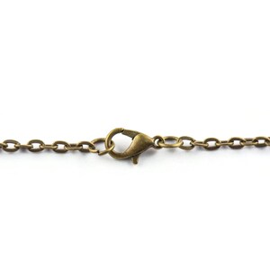 May include: A gold-toned chain with a lobster clasp closure.