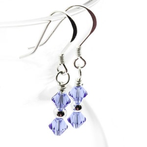 September Sapphire Swarovski Crystal Birth Month Sterling Silver Drop Earrings hanging on vase