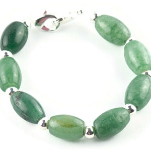 May include: A green jade stone bracelet with silver beads and a clasp.