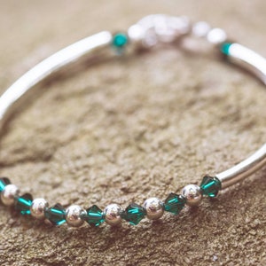 May Emerald Swarovski Crystal Birth Month Sterling Silver Plated Bracelet on stone