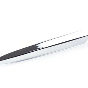 May include: A silver letter opener with a pointed tip and a rounded handle.
