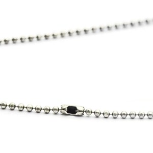 May include: A silver ball chain necklace with a silver clasp.