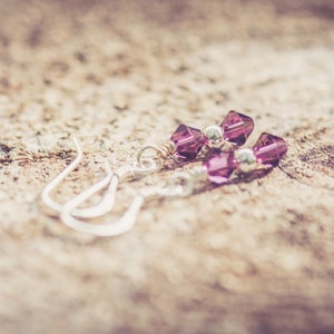 February Amethyst Swarovski Crystal Birth Month Sterling Silver Drop Earrings on wood background