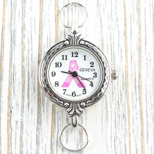 Pink Ribbon Silberfarbenes Zifferblatt • Weißes Zifferblatt • DIY Perlen Uhr • Schmuckherstellung • Analog • Schlaufen und Batterie enthalten Bild 1