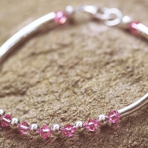 October Rose Swarovski Crystal Birth Month Sterling Silver Plated Bracelet on stone
