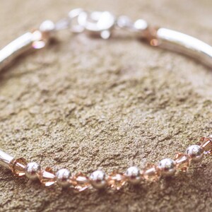 November Topaz Swarovski Crystal Birth Month Sterling Silver Plated Bracelet on stone