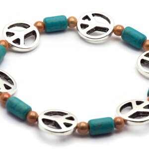 May include: A silver peace sign charm bracelet with turquoise and copper beads.