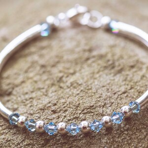 March Aquamarine Swarovski Crystal Birth Month Sterling Silver Plated Bracelet on stone