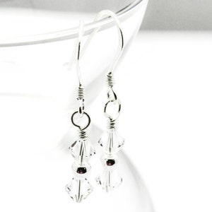 April Diamond Swarovski Crystal Birth Month Sterling Silver Drop Earrings hanging on vase
