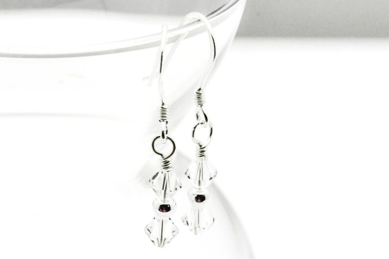 April Diamond Swarovski Crystal Birth Month Sterling Silver Drop Earrings hanging on vase