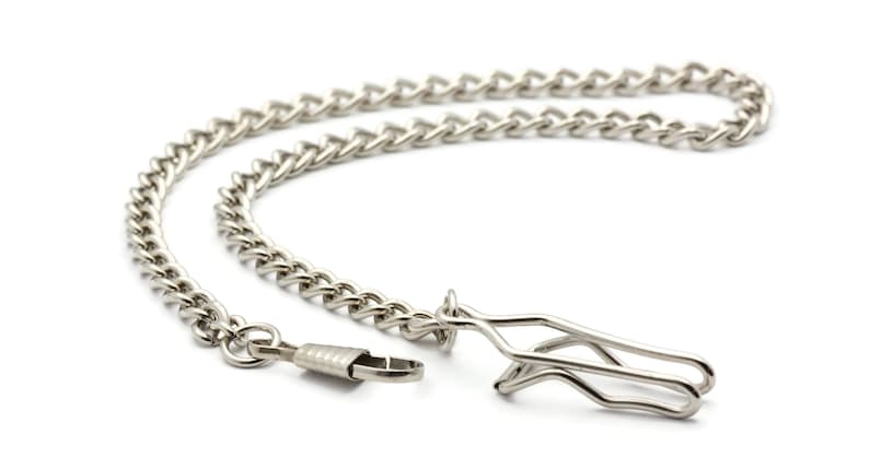 May include: A silver chain with a silver clasp. The chain is made of a curb link pattern.